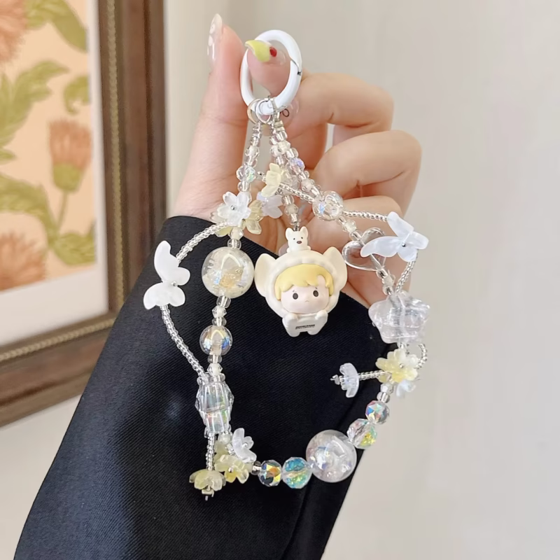 With blurs of colors like blushing rose and warm sunshine, the Dimoo Cry Baby Pajama Party Series phone chain clockwise - Image 3