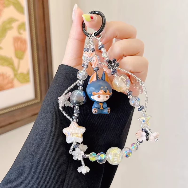 With blurs of colors like blushing rose and warm sunshine, the Dimoo Cry Baby Pajama Party Series phone chain clockwise - Image 2
